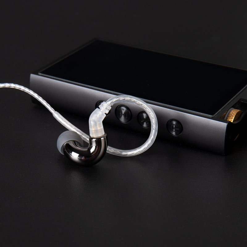 BLON BL-mini with cable along with an audio player in black surface
